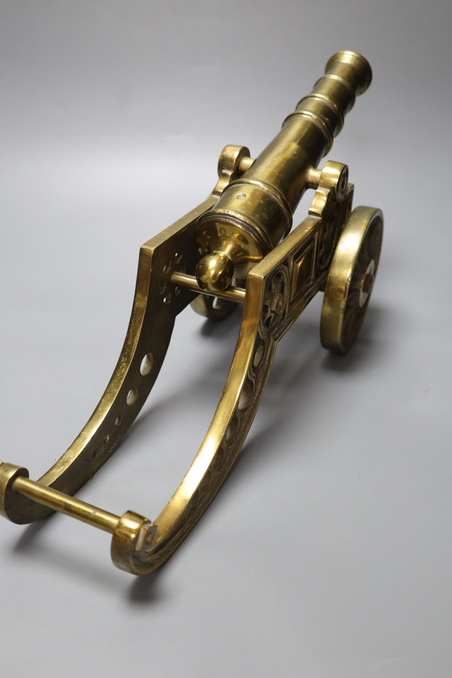 A large brass signal cannon on elaborate carriage, length 42cm